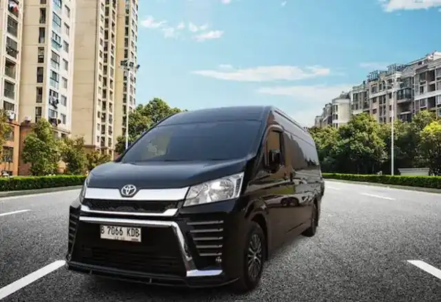 Black Toyota Hiace viewed from the front and side